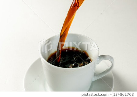 Pour coffee into a mug 124861708