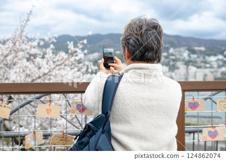 man taking photo with smartphone 124862074