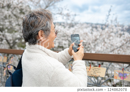 man taking photo with smartphone man taking photo with smartphone 124862078