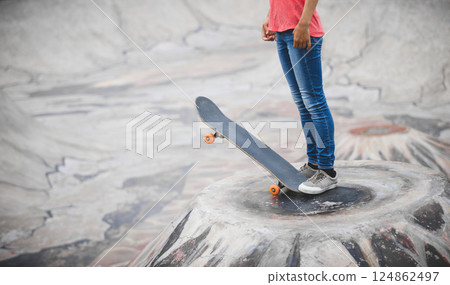 Skateboarder skateboarding at skatepark in city 124862497
