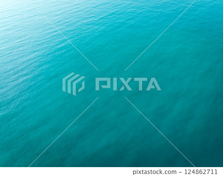 Aerial view of blue sea surface Aerial view of blue sea surface 124862711