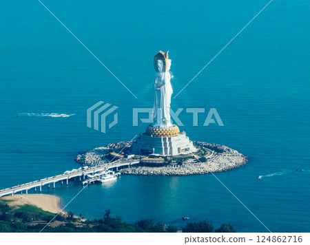 Guanyin statue at seaside in nanshan temple, hainan island , China. Words mean mercy and blessing. 124862716