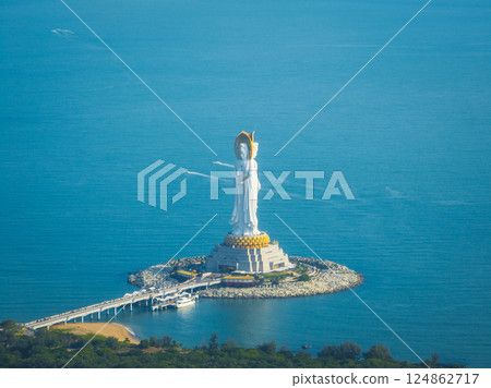 Guanyin statue at seaside in nanshan temple, hainan island , China. Words mean mercy and blessing. Guanyin statue at seaside in nanshan temple, hainan island , China. Words mean mercy and blessing. 124862717