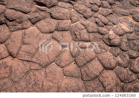 The surface of sun cracks rock in Phu Langka National Park of Bueng Kan province, Thailand. 124863160
