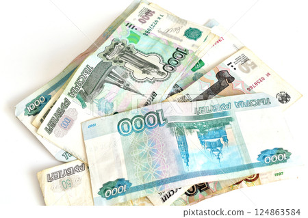 Russian currency is lying on the table 124863584