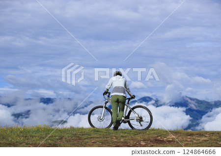 Riding mountain bike on beautiful mountain top 124864666