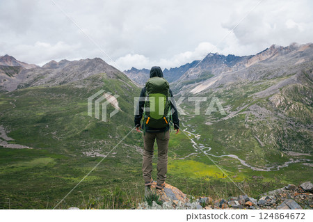 Hiking woman on high altitude mountain top Hiking woman on high altitude mountain top 124864672