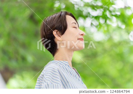 Fresh greenery Middle-aged woman Beauty 124864794