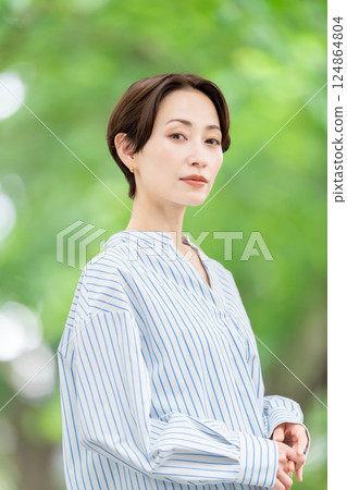 Fresh greenery Middle-aged woman Beauty 124864804