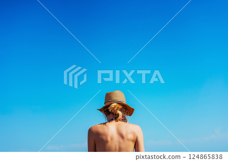 girl in a swimsuit on the shore of Lake Kapchagay. colored swimsuit on a girl 124865838