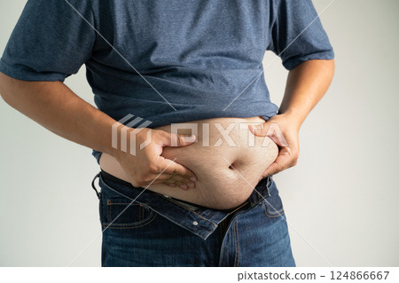 Overeating causes belly fat, tight jeans, and  124866667