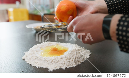 Grate Orange Zest Into Easter Cake Dough 124867272