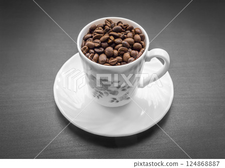 A cup with coffee beans 124868887