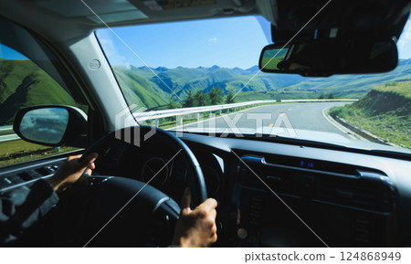 Driving offroad car on high elevation mountains 124868949