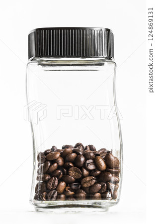 Jar with coffee grains 124869131