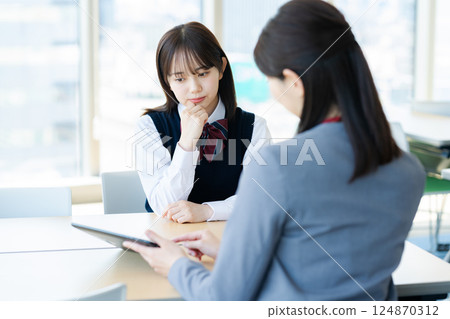 Female student consulting 124870312