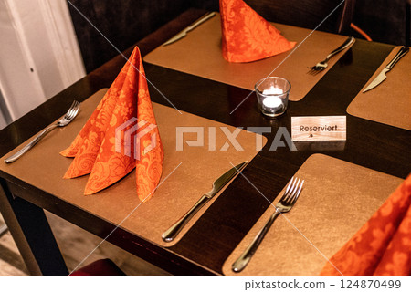German Reserved sign label on the table of restaurant in an Germany city German Reserved sign label on the table of restaurant in an Germany city 124870499