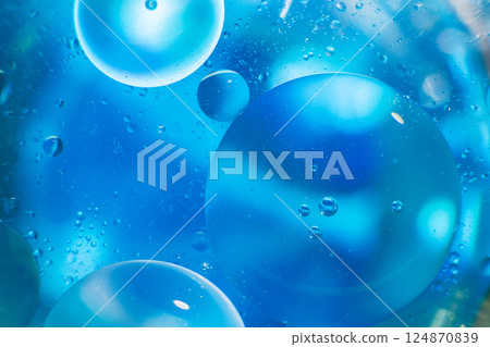 Oil bubbles close up. circles of water macro. abstract light blue background Oil bubbles close up. circles of water macro. abstract light blue background 124870839