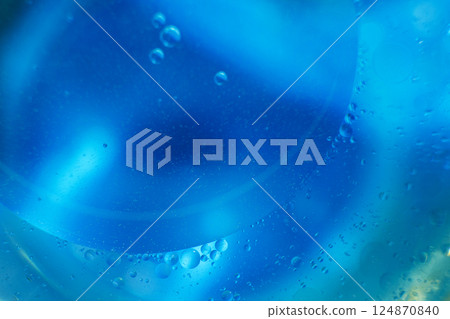 Oil bubbles close up. circles of water macro. abstract light blue background Oil bubbles close up. circles of water macro. abstract light blue background 124870840