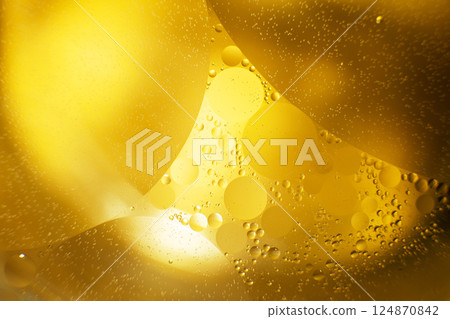 Gold Oil bubbles. circles of orange water macro. abstract yellow background Gold Oil bubbles. circles of orange water macro. abstract yellow background 124870842