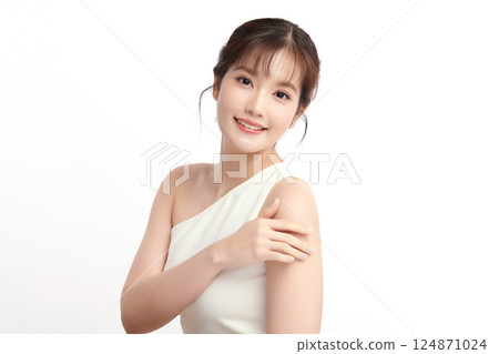 A beautiful young Asian woman with clean, fresh skin against a white background. Skincare, facial treatment, cosmetology, beauty, and spa. An elegant portrait of an Asian woman. A beautiful young Asian woman with clean, fresh skin against a white background. Skincare, facial treatment, cosmetology, beauty, and spa. An elegant portrait of an Asian woman. 124871024