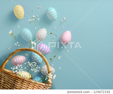 Pastel colors Easter eggs in a beautiful basket against a blue background Pastel colors Easter eggs in a beautiful basket against a blue background 124872192