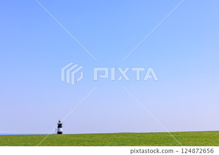 The octagonal Notoro Cape Lighthouse with its black and white stripes in Abashiri, Hokkaido [May] 124872656