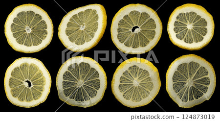 Falling lemon slices on black background, collection of citrus cuts 124873019