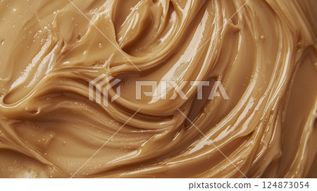 Smooth caramel texture swirl, macro closeup 124873054