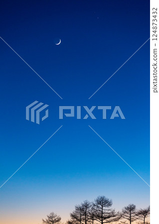 Jupiter, Saturn, and the crescent moon in a beautiful evening sky with afterglow 1 124873432