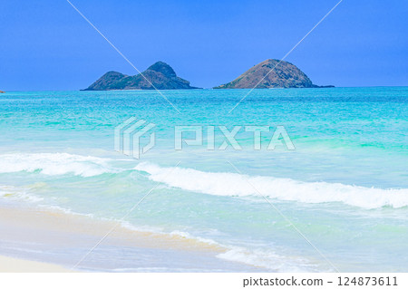 Hawaiian Holidays: Mokulua Islands as seen from Bellows Beach on Oahu 124873611