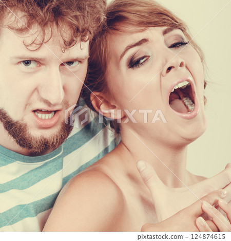 Angry man strangling screaming woman, violence 124874615