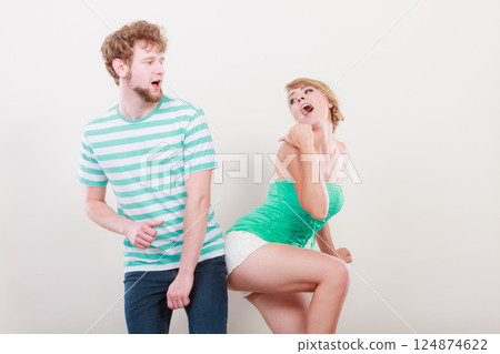 Playful young couple blonde girl bearded man Playful young couple blonde girl bearded man 124874622