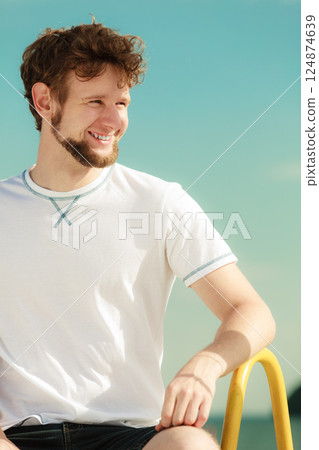 Happy fashion man relaxing enjoying summer outdoor Happy fashion man relaxing enjoying summer outdoor 124874639