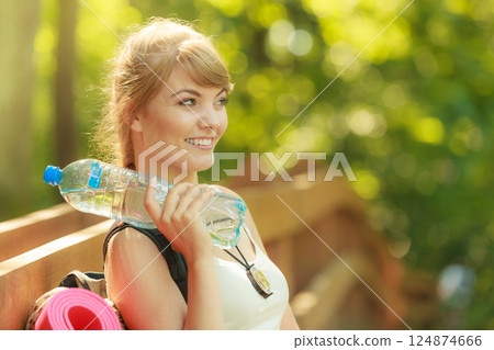 Tourist woman with backpack water bottle Tourist woman with backpack water bottle 124874666