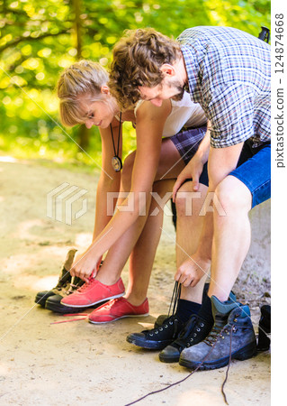 Hiker young couple with backpack in nature 124874668