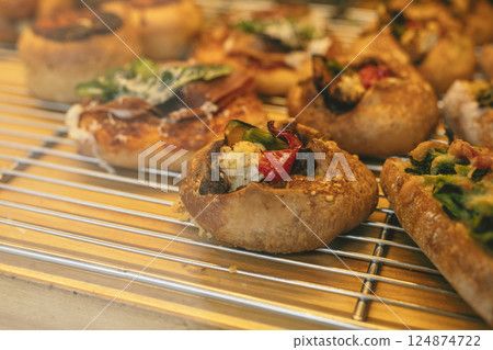 Rows of prepared breads, bakery, bakery 124874722