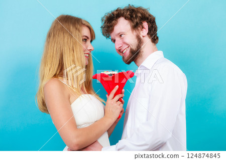 Happy couple with candy bunch flowers. Love. 124874845