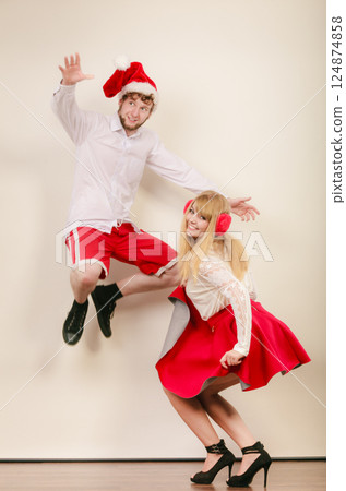 Happy active couple dancing and jumping. 124874858