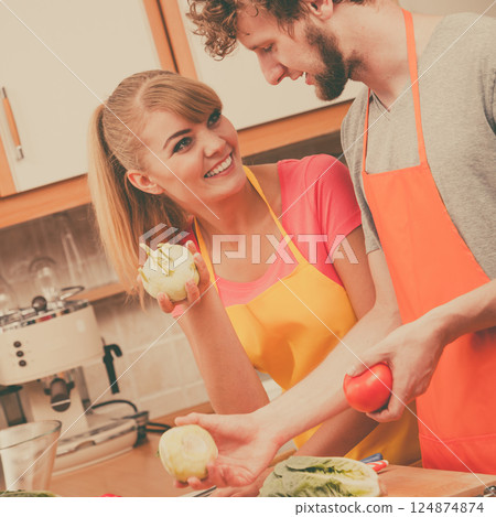Couple preparing fresh vegetables food salad Couple preparing fresh vegetables food salad 124874874