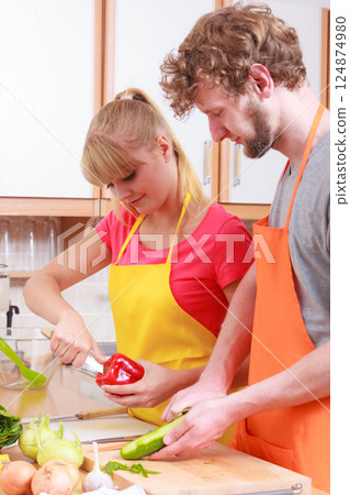 Couple preparing fresh vegetables salad. Diet Couple preparing fresh vegetables salad. Diet 124874980