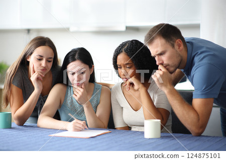 Four suspicious interracial roommates checking contract 124875101