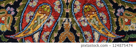Manufacturing process, weaving of a traditional wool oriental red carpet with an intricate floral pattern, decorative elements. banner Manufacturing process, weaving of a traditional wool oriental red carpet with an intricate floral pattern, decorative elements. banner 124875474
