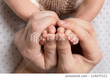 Newborn baby feet. Motherhood concept. Mother day. Copy space. Selective focus 124875521