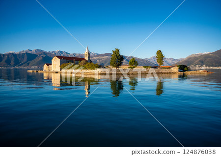 View of Our Lady of Mercy Island from yacht boat near Tivat city in Kotor bay of Adriatic sea in Montenegro in winter time View of Our Lady of Mercy Island from yacht boat near Tivat city in Kotor bay of Adriatic sea in Montenegro in winter time 124876038