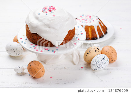 Traditional Easter cake decorated with colorful icing and sprinkles, symbolizing the festive spirit Traditional Easter cake decorated with colorful icing and sprinkles, symbolizing the festive spirit 124876909