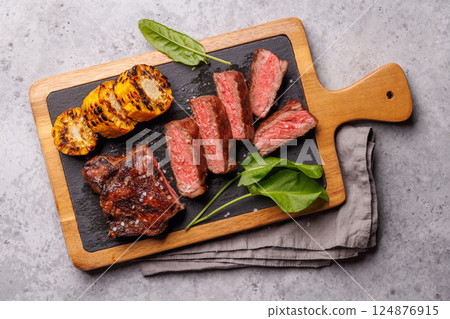 A perfectly cooked sliced striploin steak with a juicy, tender texture 124876915