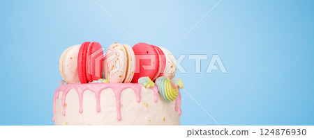 A beautifully decorated cake adorned with colorful macarons A beautifully decorated cake adorned with colorful macarons 124876930