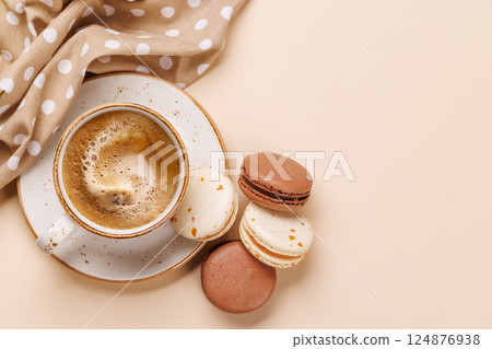 A delightful combination of freshly brewed coffee and delicate macaroons A delightful combination of freshly brewed coffee and delicate macaroons 124876938