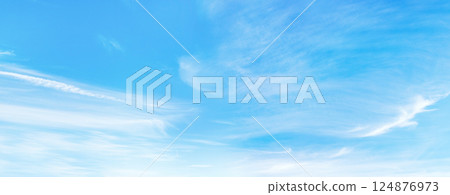 Majestic sunny sky with scattered small clouds Majestic sunny sky with scattered small clouds 124876973